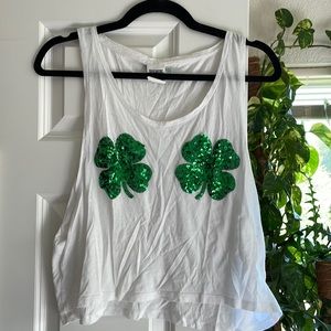 White crop tank,  green shamrock sequins, wide opening in arm pit. Light use